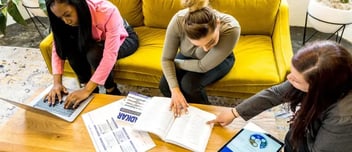 A group of professionals looking at Prosci resources