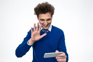 Happy business man using smartphone over white background