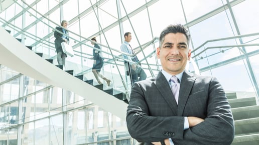 business-man-standing-in-front-of-stairs