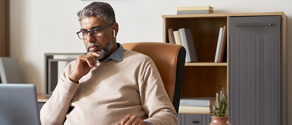 Man looking at a computer