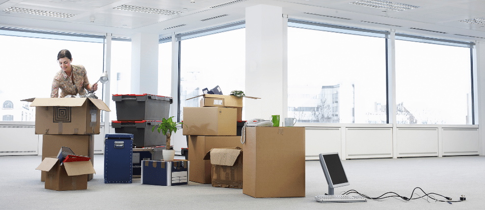 business-woman-impacted-by-organizational-change-moving-into-new-office