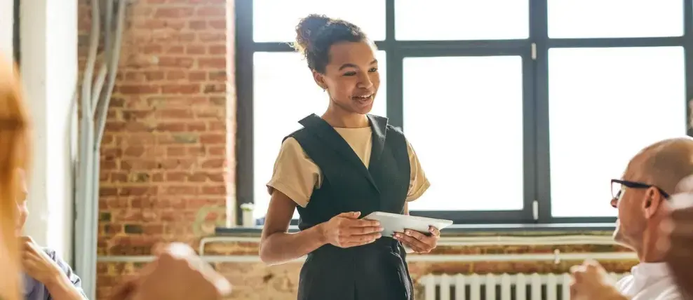 Colleagues discussing the Prosci ADKAR Model